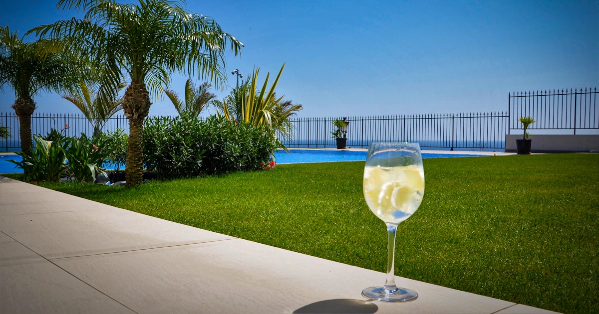 Marbella poolside with palm trees, hospitality industry workplace