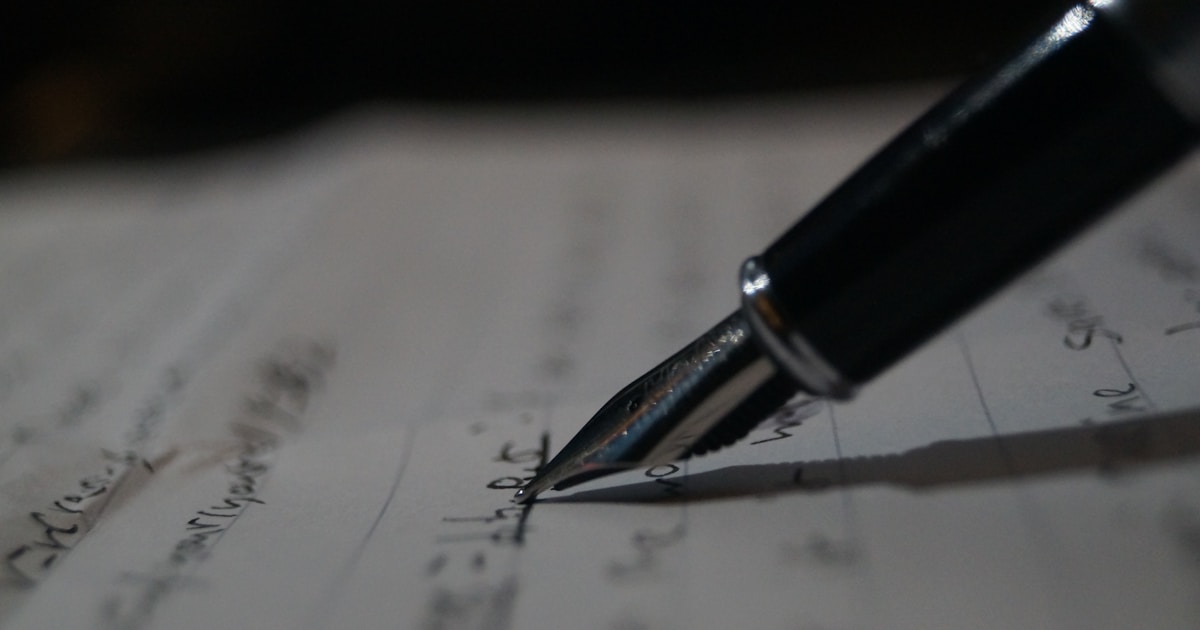 Pen resting on a paper document, moment of signing — incorporation of a Spanish company